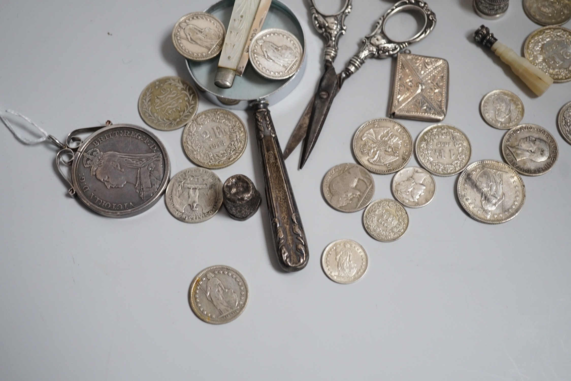 Miscellaneous small silver and white metal items including thimbles, a cigarette case, envelope stamp case, fruit knife, seal, etc and a group of assorted coinage including a silver crown in pendant mount.